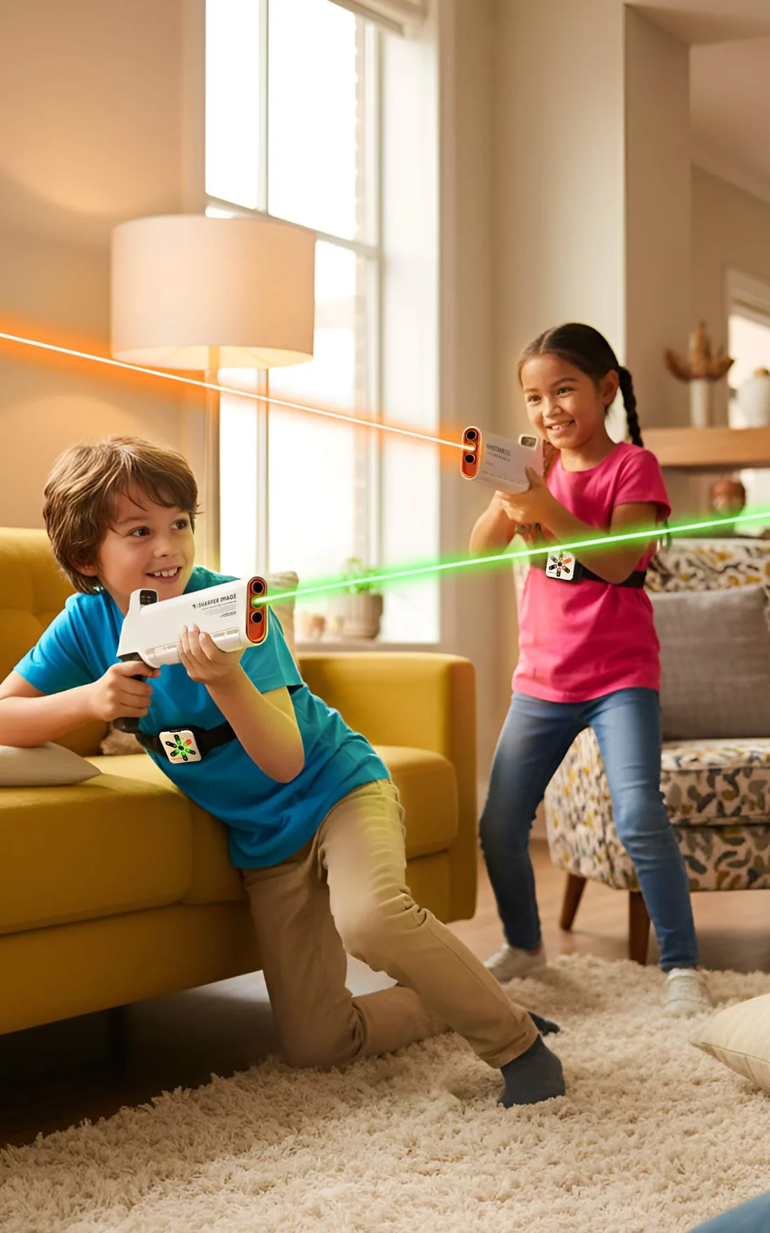 Two children playing an infrared laser tag game in a living room